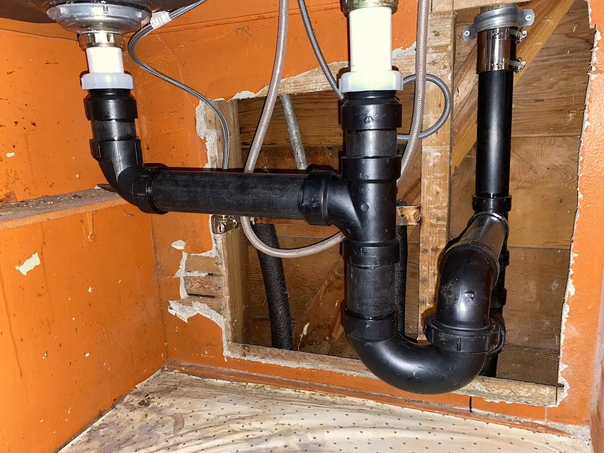 Professional Garbage Disposal Repair equipment and tools on the job in Peters